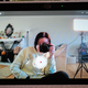 A photo of a person taking a picture of herself in the Facebook Portal Go's camera app